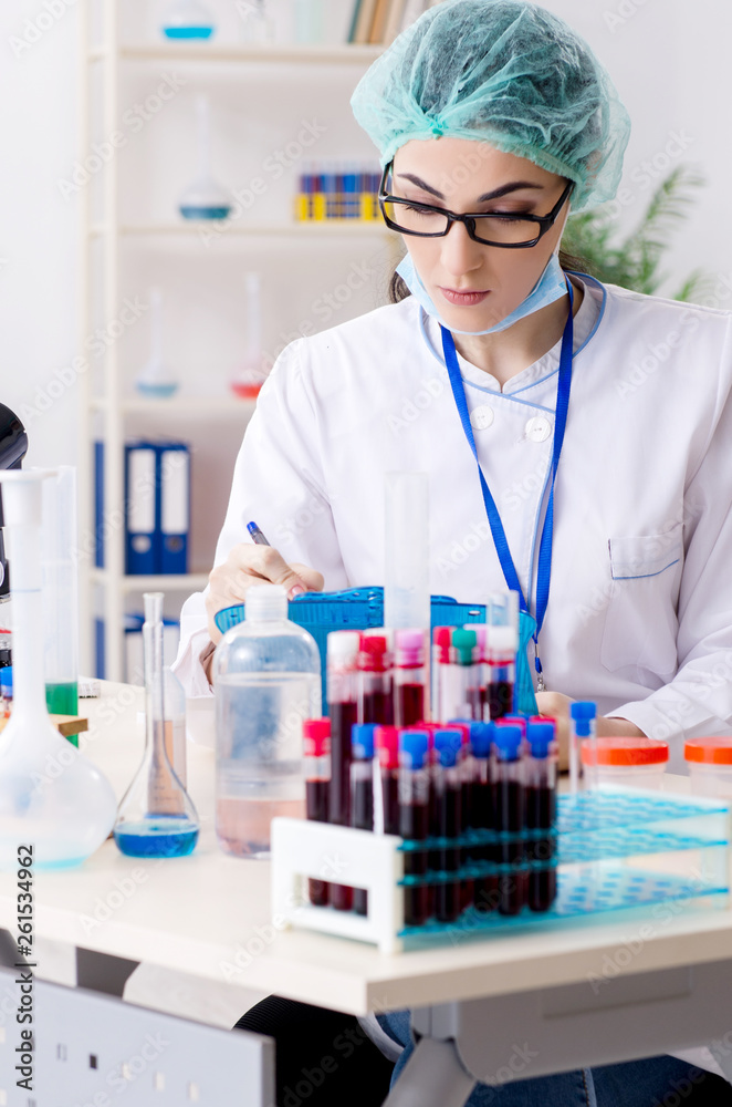 Young female chemist working in the lab Young female chemist working in the lab