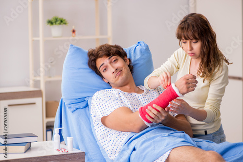 Loving wife looking after injured husband in hospital 