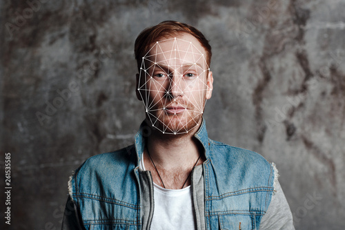 Facial recognition security system. Face augment mobile phone technology concept.