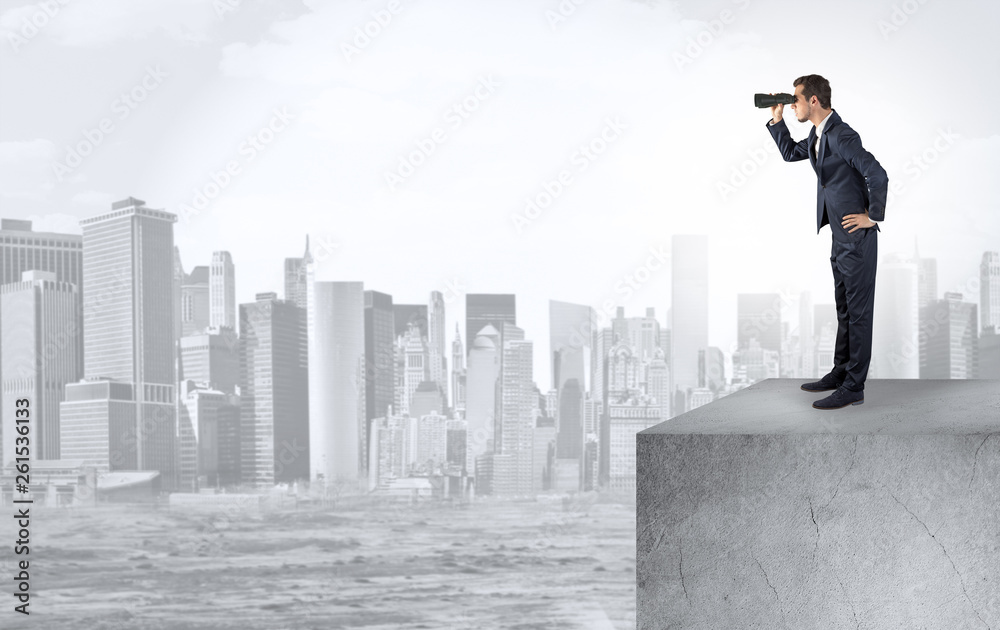 Young investor looking to the city from distance and thinking about investment
Young investor looking to the city from distance and thinking about investment