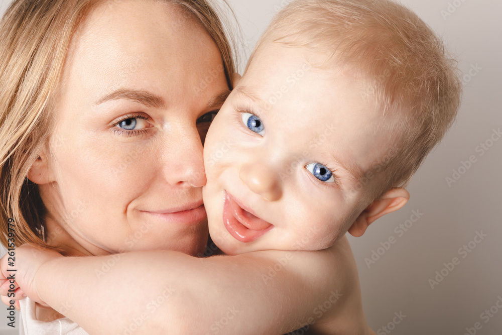 Portrait of a baby boy in his mother's arms. Portrait of a baby boy in his mother's arms.