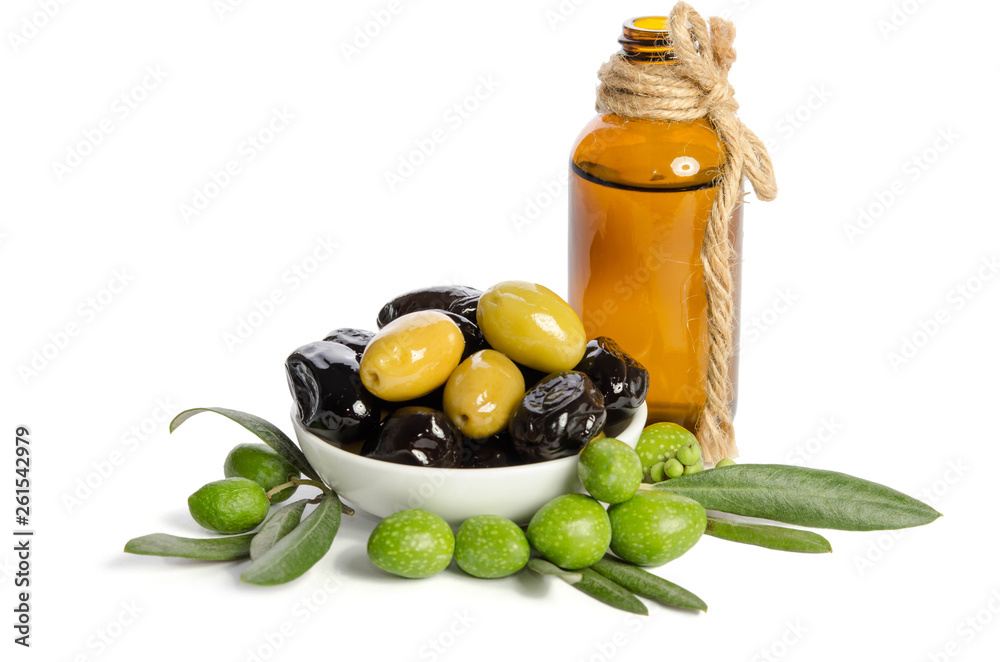 Black and green olives mixed in the porcelain bowl and Virgin olive oil in a crystal bottle isolated on white background Black and green olives mixed in the porcelain bowl and Virgin olive oil in a crystal bottle isolated on white background
