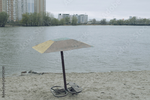 old umbrella by the lake photo