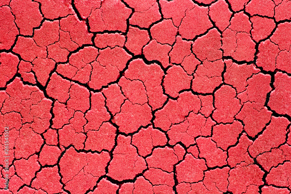 Fototapeta premium Cracked red wall patterns. Abstract background texture