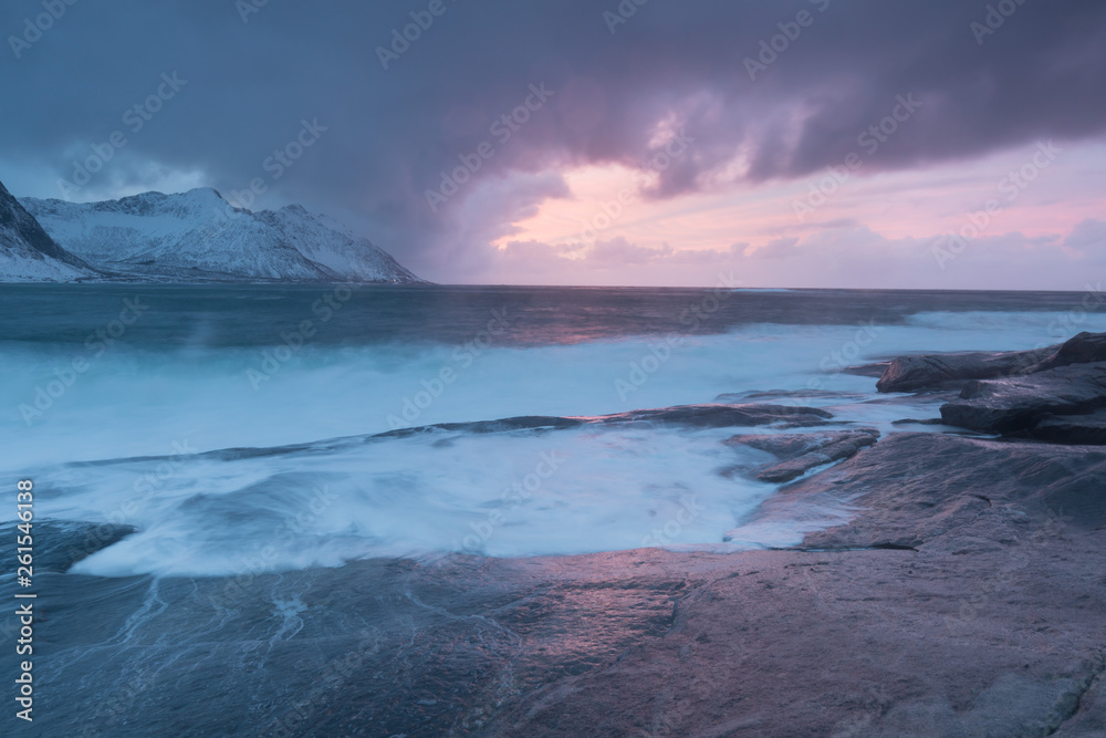 Amazing Sunset Over Mountain And Fjord, Winter Landscape, Norway The sun sets on the Norwegian Alps and the blue hour begins in range at Senja, Norway. Beautiful christmas time near Troms country. 