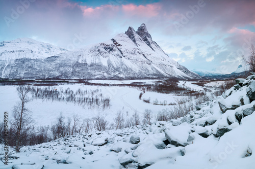 Beautiful landscape scene with Signaldalelva river and Otertinden mountain in background in Northern Norway . Sunset or sunrise in Mountains And Fjords, Winter Landscape. photo