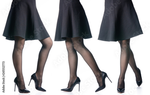 Set female legs in black high heels shoes black skirt fashion on white background isolation