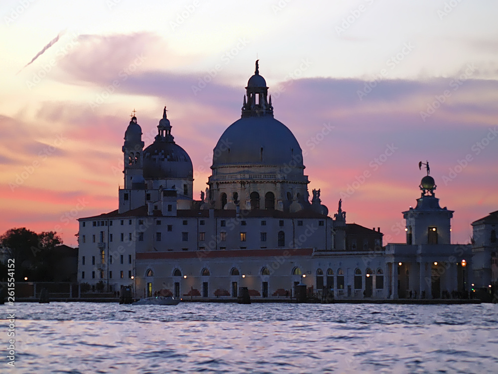 colorful sunset over the church Santa Maria della Salute in Venice