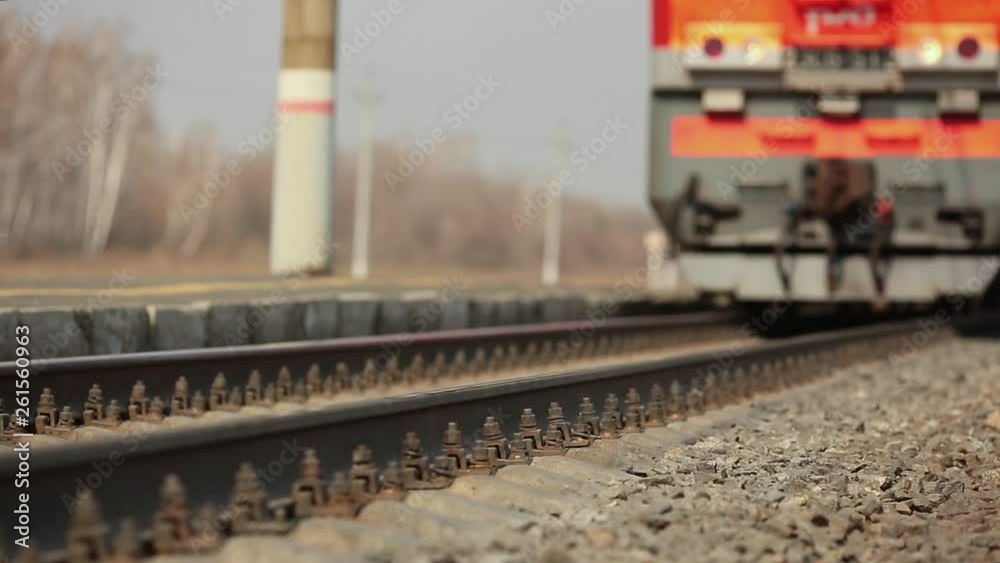 The wheels of old train on the railway track passing by camera. Close up shot