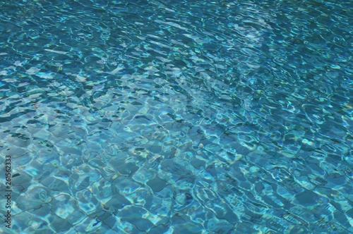 blue water in swimming pool background texture