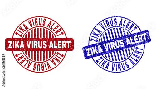 Grunge ZIKA VIRUS ALERT round stamp seals isolated on a white background. Round seals with distress texture in red and blue colors.