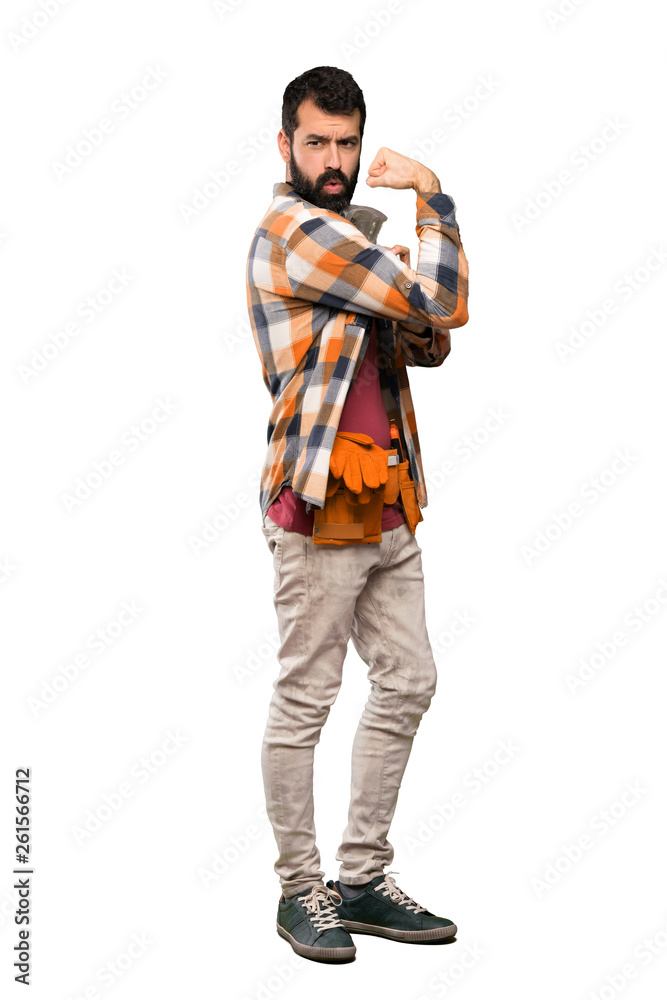 Craftsmen man doing strong gesture over isolated white background Craftsmen man doing strong gesture over isolated white background