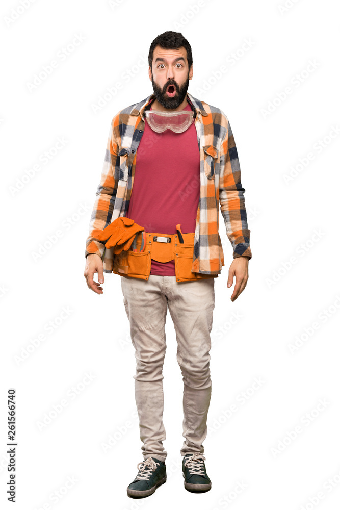 Craftsmen man with surprise facial expression over isolated white background Craftsmen man with surprise facial expression over isolated white background