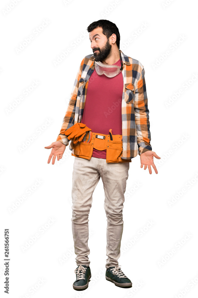 Craftsmen man making doubts gesture looking side over isolated white background Craftsmen man making doubts gesture looking side over isolated white background
