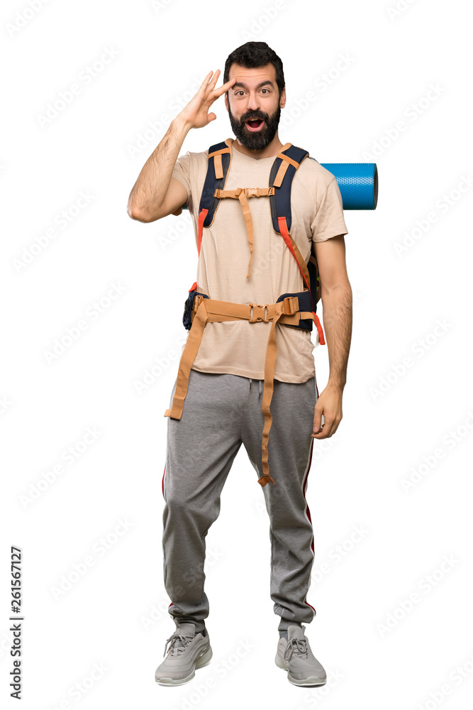 Hiker man has just realized something and has intending the solution over isolated white background Hiker man has just realized something and has intending the solution over isolated white background