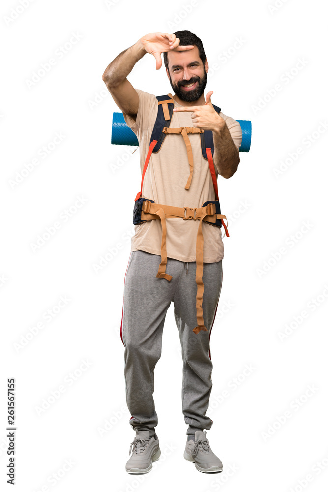 Hiker man focusing face. Framing symbol over isolated white background Hiker man focusing face. Framing symbol over isolated white background