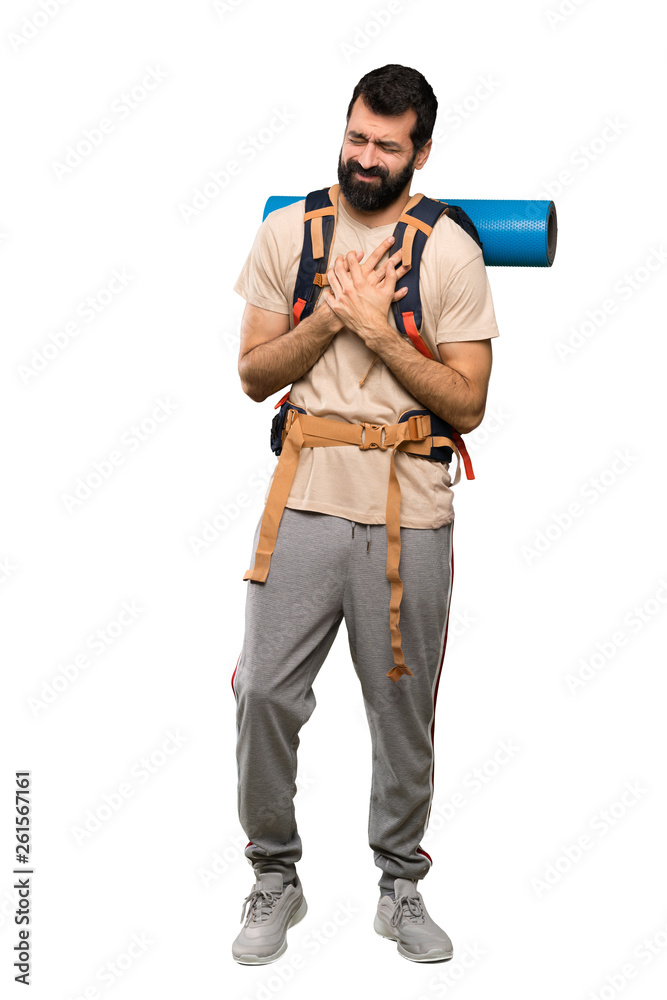 Hiker man having a pain in the heart over isolated white background Hiker man having a pain in the heart over isolated white background