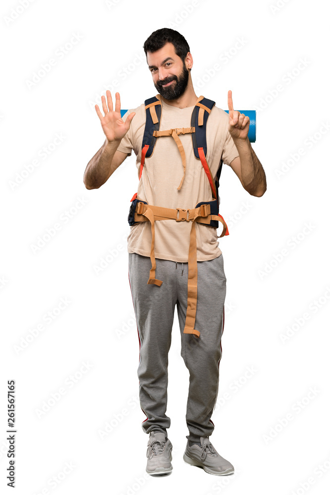 Hiker man counting six with fingers over isolated white background Hiker man counting six with fingers over isolated white background
