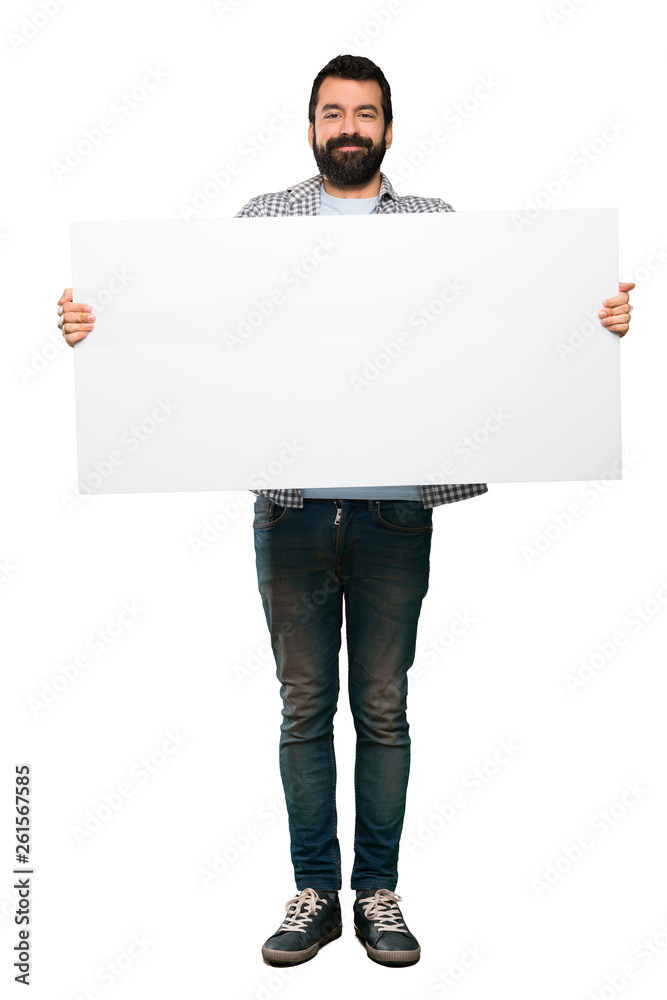 Handsome man with beard holding an empty placard Handsome man with beard holding an empty placard