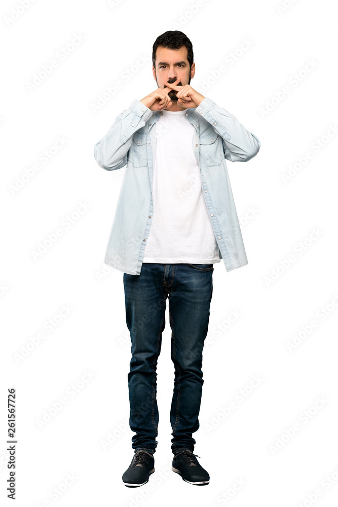 Full-length shot of Handsome man with beard showing a sign of silence gesture over isolated white background Full-length shot of Handsome man with beard showing a sign of silence gesture over isolated white background
