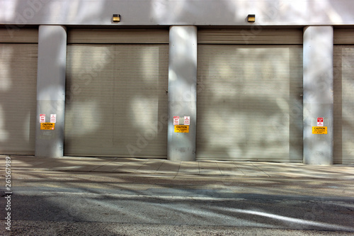 Wallpaper Mural sidewalk and garage door entrance with light, shadow and reflection  Torontodigital.ca