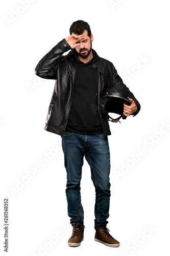 Full-length shot of Biker man with tired and sick expression over isolated white background