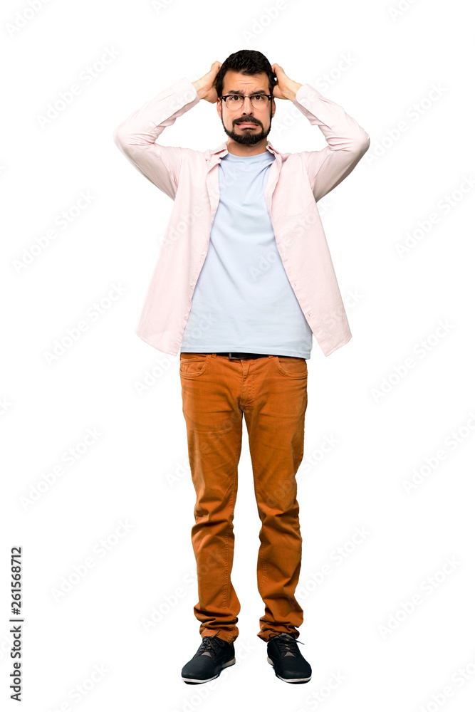 Full-length shot of Handsome man with beard frustrated and takes hands on head over isolated white background Full-length shot of Handsome man with beard frustrated and takes hands on head over isolated white background