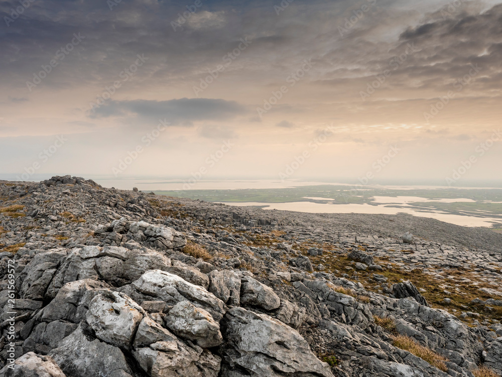 View on Galway bay from The Burren mountains. Ireland, Rocks, stone , moody sky.