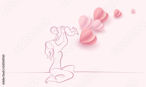 Woman hold her baby with air balloons