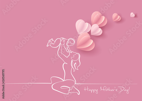 Woman hold her baby with air balloons