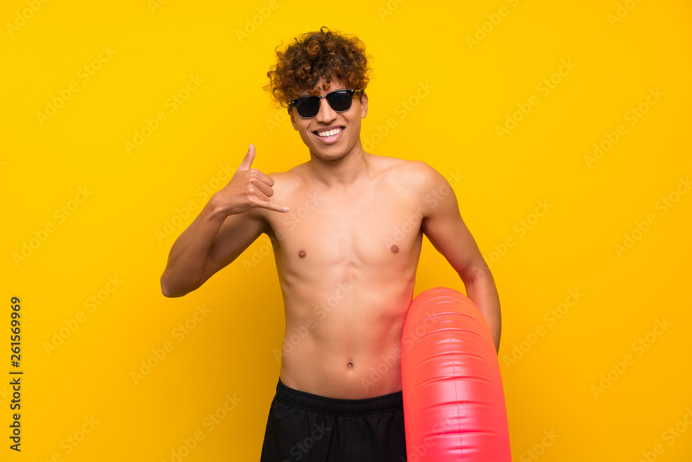 African american man over isolated purple wall making phone gesture African american man over isolated purple wall making phone gesture