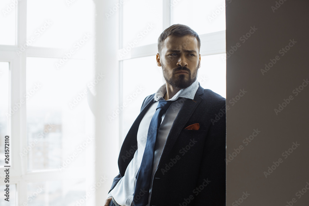Businessman Near Window in Office. Businessman Near Window in Office.