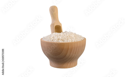 long grain white rice in wooden bowl and scoop isolated on white background. nutrition. bio. natural food ingredient.