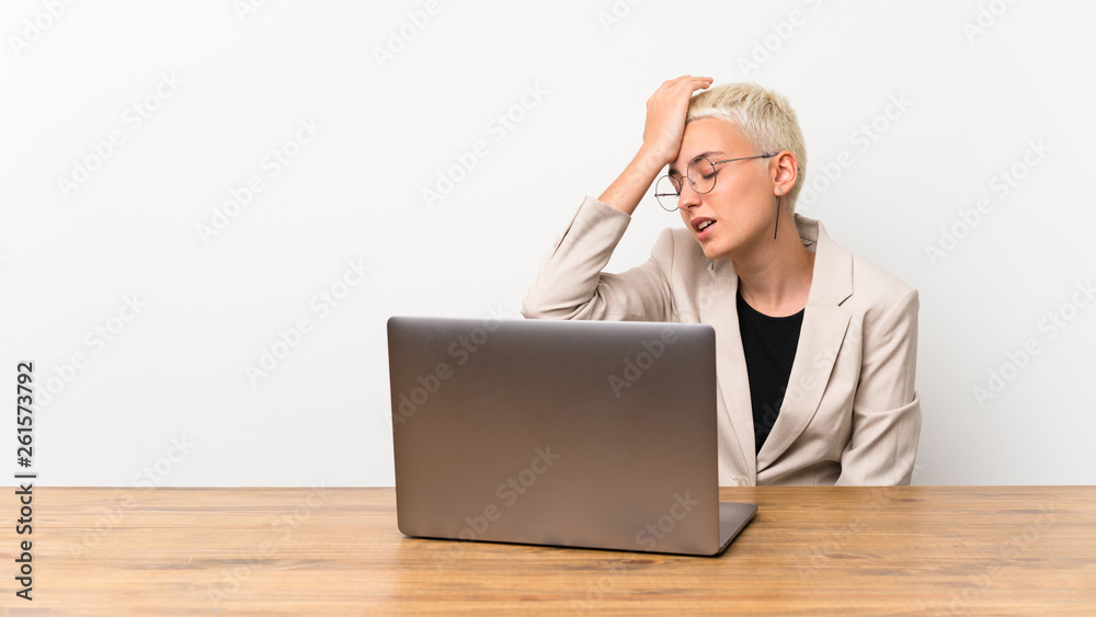 Teenager girl with short hair with a laptop has realized something and intending the solution Teenager girl with short hair with a laptop has realized something and intending the solution
