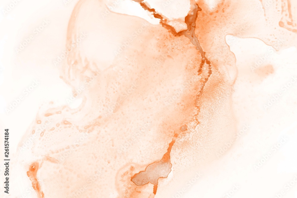 Fototapeta premium Orange alcohol ink texture with abstract washes and paint stains on the white paper background.