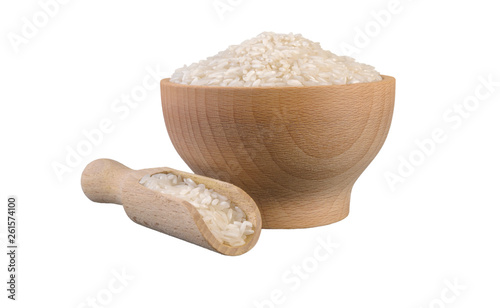 long grain white rice   in wooden bowl and scoop isolated on white background. nutrition. bio. natural food ingredient.