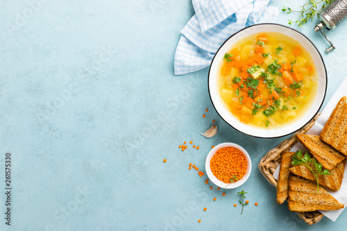 Fotografija Lentil soup with vegetables and fresh parsley on plate