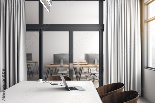 Desk with laptop in meeting room