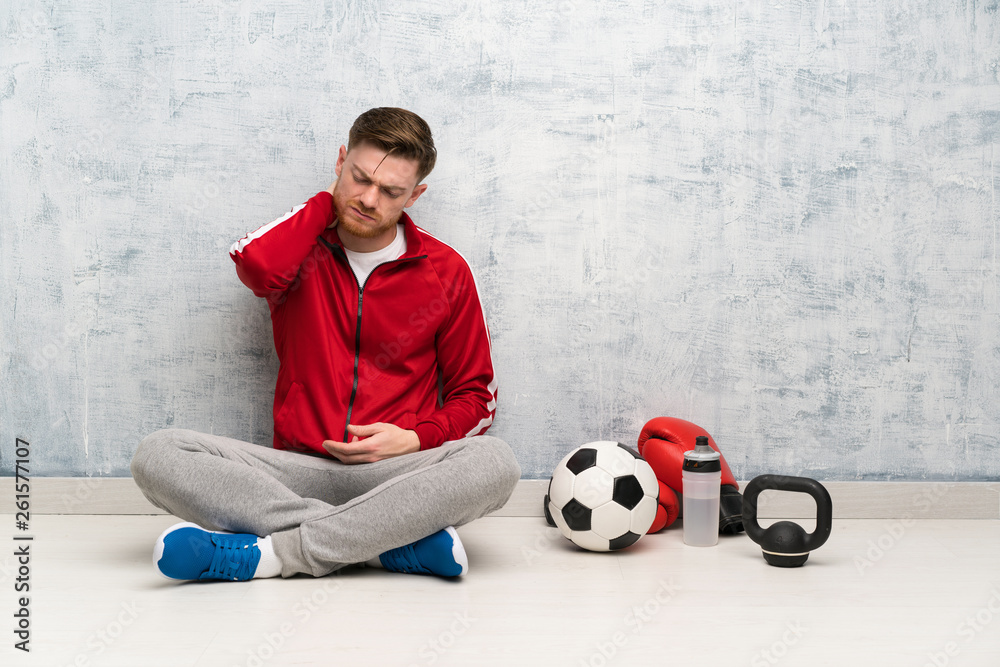 Redhead sport man with neckache Redhead sport man with neckache