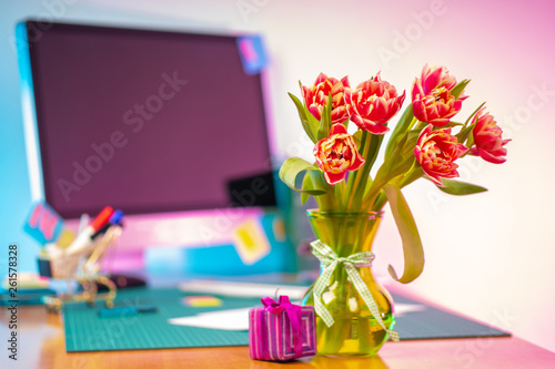 Flowers on a table with a c...