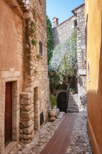 Fototapeta Naklejka Na Ścianę i Meble -  The entrance to the Chateau Eza restaurant in a narrow street in the old center of the  picturesque medieval village of Eze