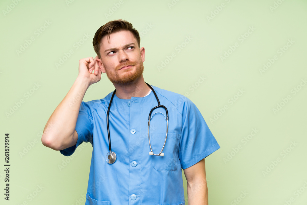 Surgeon doctor man having doubts and with confuse face expression