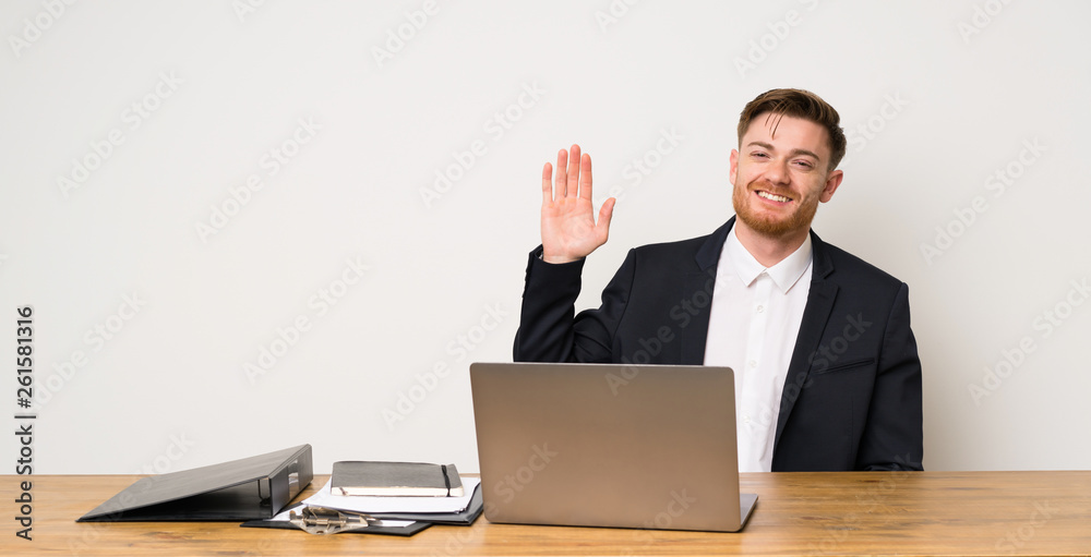 Businessman in a office saluting with hand with happy expression Businessman in a office saluting with hand with happy expression