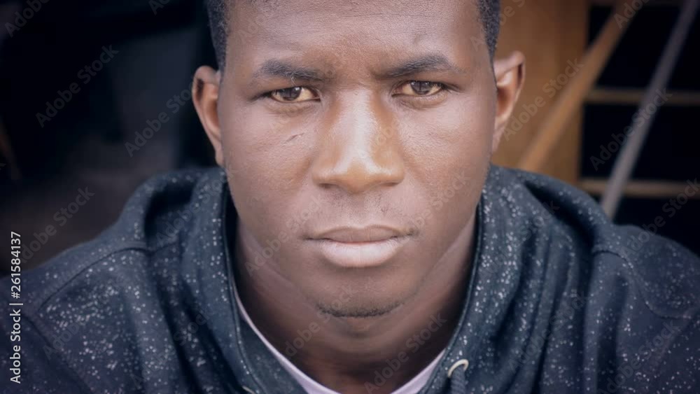 Serious confident young black african man staring at camera Serious confident young black african man staring at camera