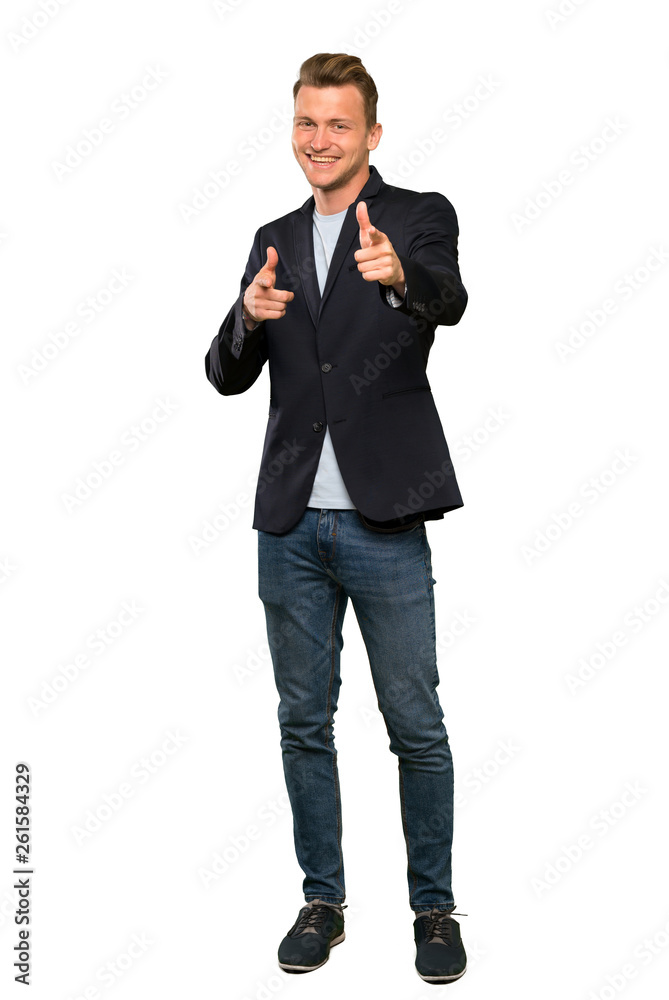 Blonde handsome man pointing to the front and smiling Blonde handsome man pointing to the front and smiling