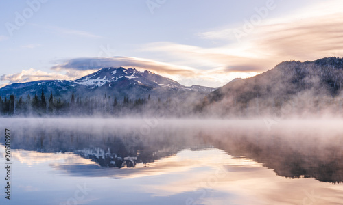 Beautiful Colorful Sunrise Over Snow Peaks on a Hike near an Alpine Lake in Oregon © Andrew