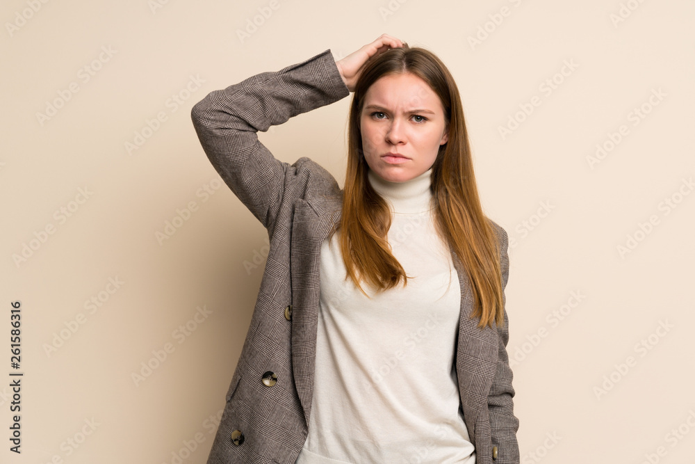 Young business woman having doubts while scratching head Young business woman having doubts while scratching head