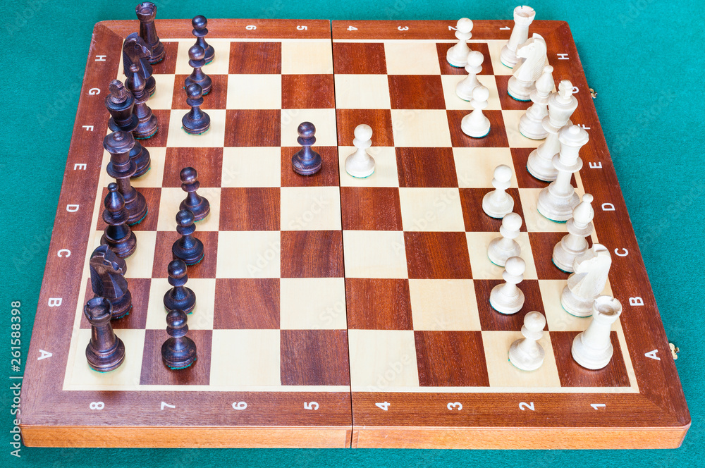 wooden chessboard with first chess pawn moves wooden chessboard with first chess pawn moves