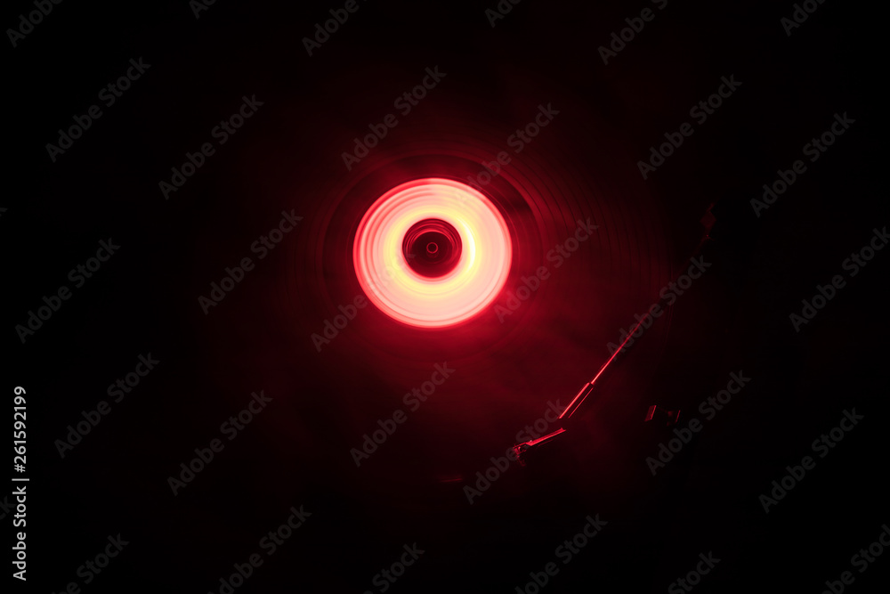 Concept of speed - Trail of fire and smoke - Vinyl record. Burning vinyl disk. Turntable vinyl record player. Retro audio equipment for disc jockey. Sound technology Concept of speed - Trail of fire and smoke - Vinyl record. Burning vinyl disk. Turntable vinyl record player. Retro audio equipment for disc jockey. Sound technology