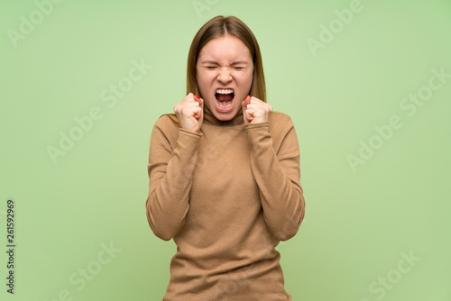 Young woman with turtleneck sweater frustrated by a bad situation